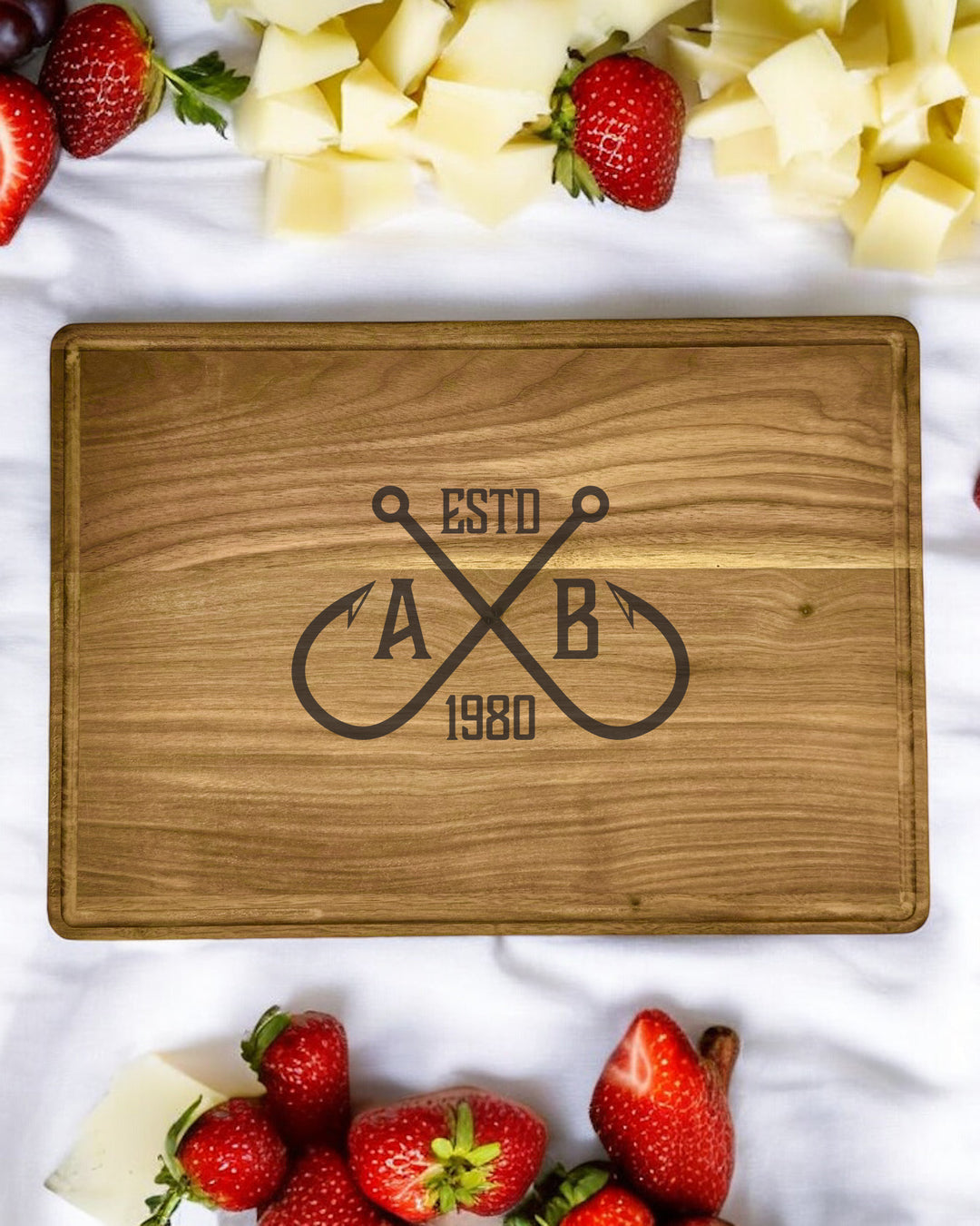 A personalized walnut cutting board with a crossing hooks design, featuring a custom name or message.