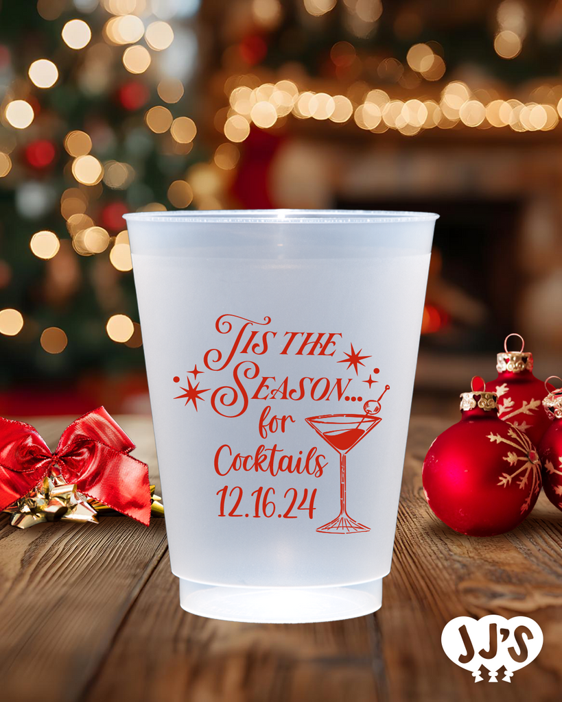 A close-up of a frosted plastic cup with a Christmas tree design and a personalized name.