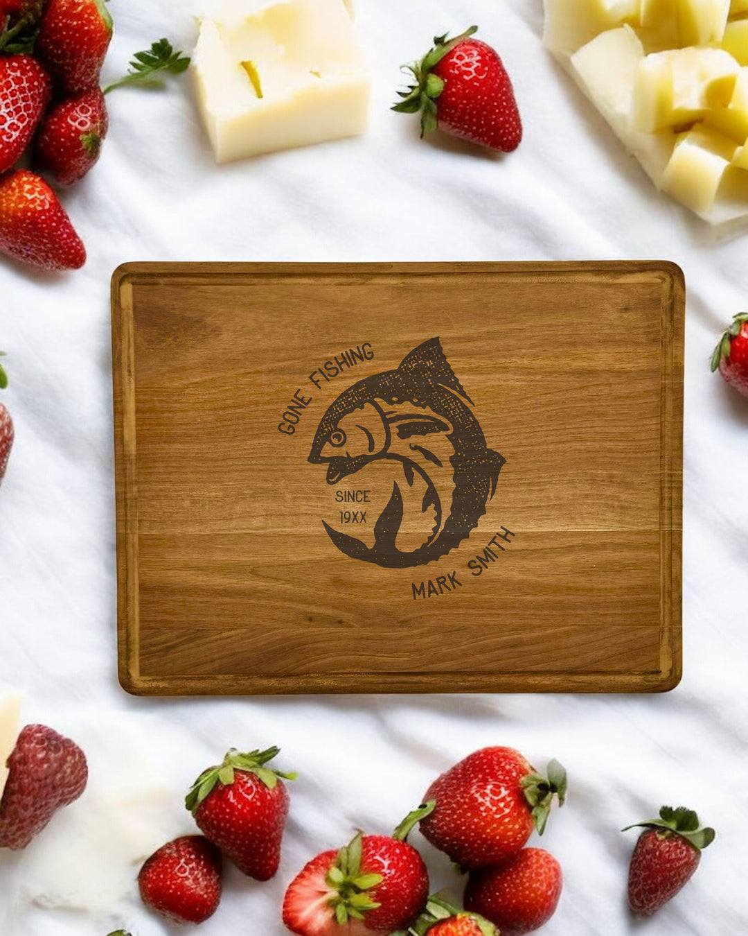 Personalized Gone Fishing Walnut Cutting Board with engraved name or message.