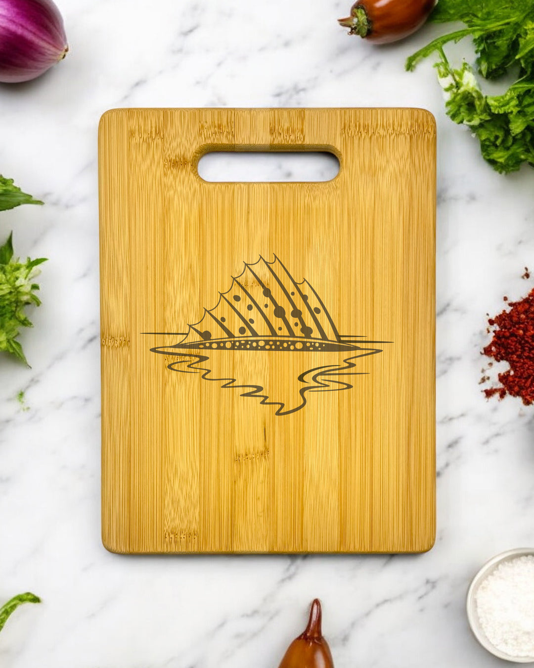 A personalized bamboo cutting board featuring an image of a speckled trout.