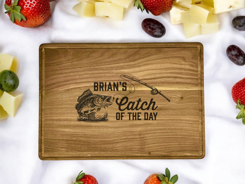 A personalized walnut cutting board with a 